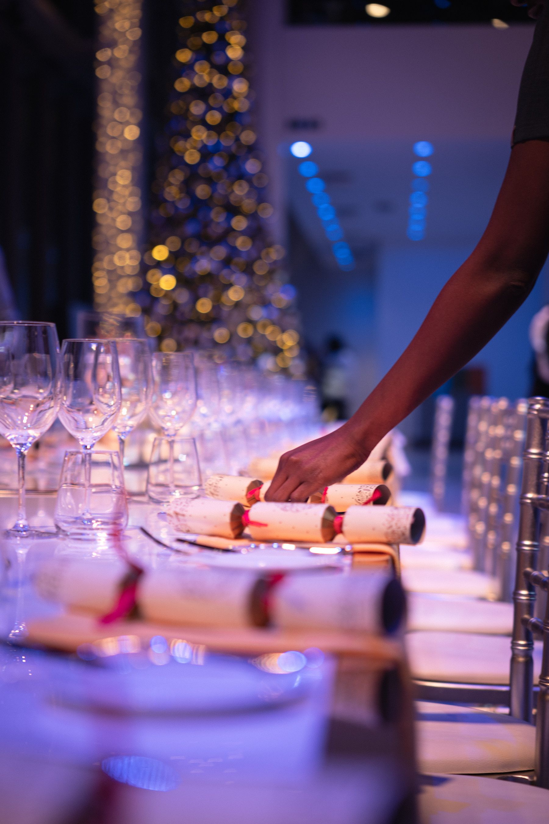 Straightening Christmas crackers before an event