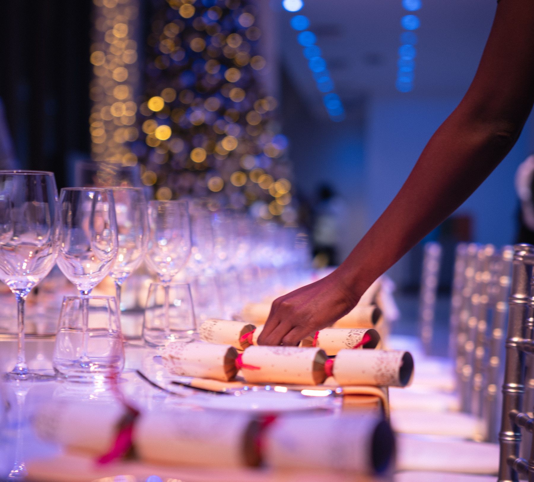 Straightening Christmas crackers before an event