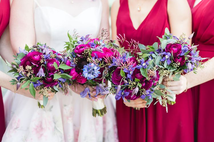 Bride and bridesmaids holding flowers