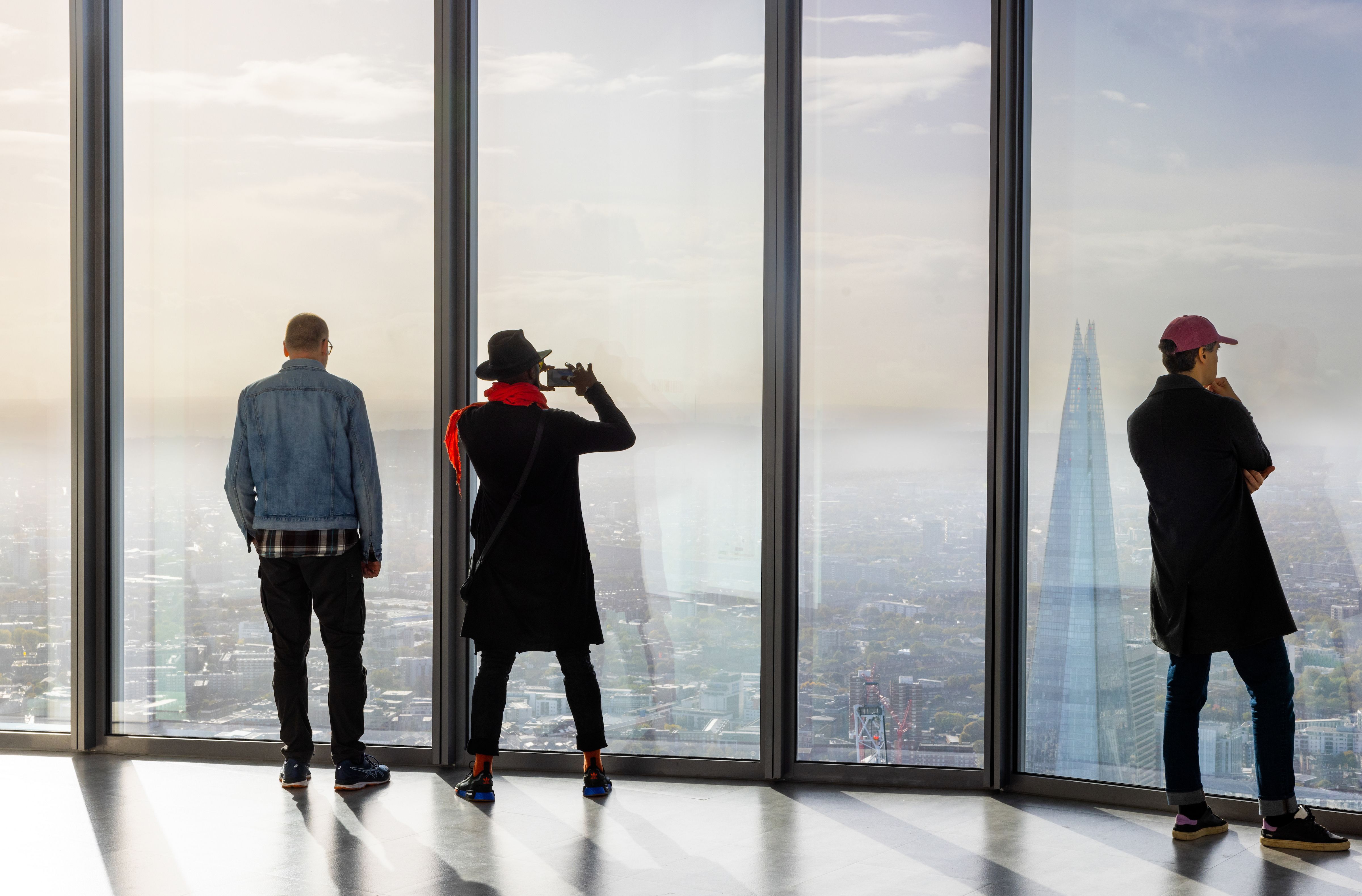 People looking at London skyline