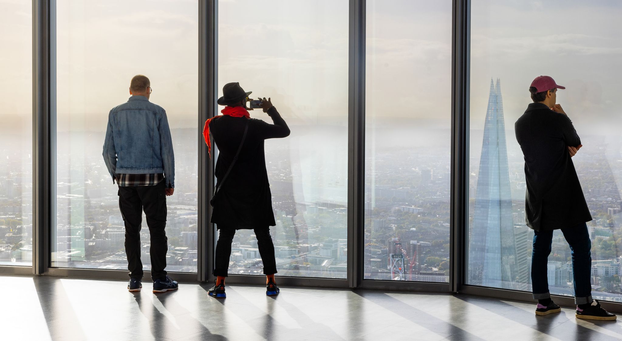 People looking at London skyline