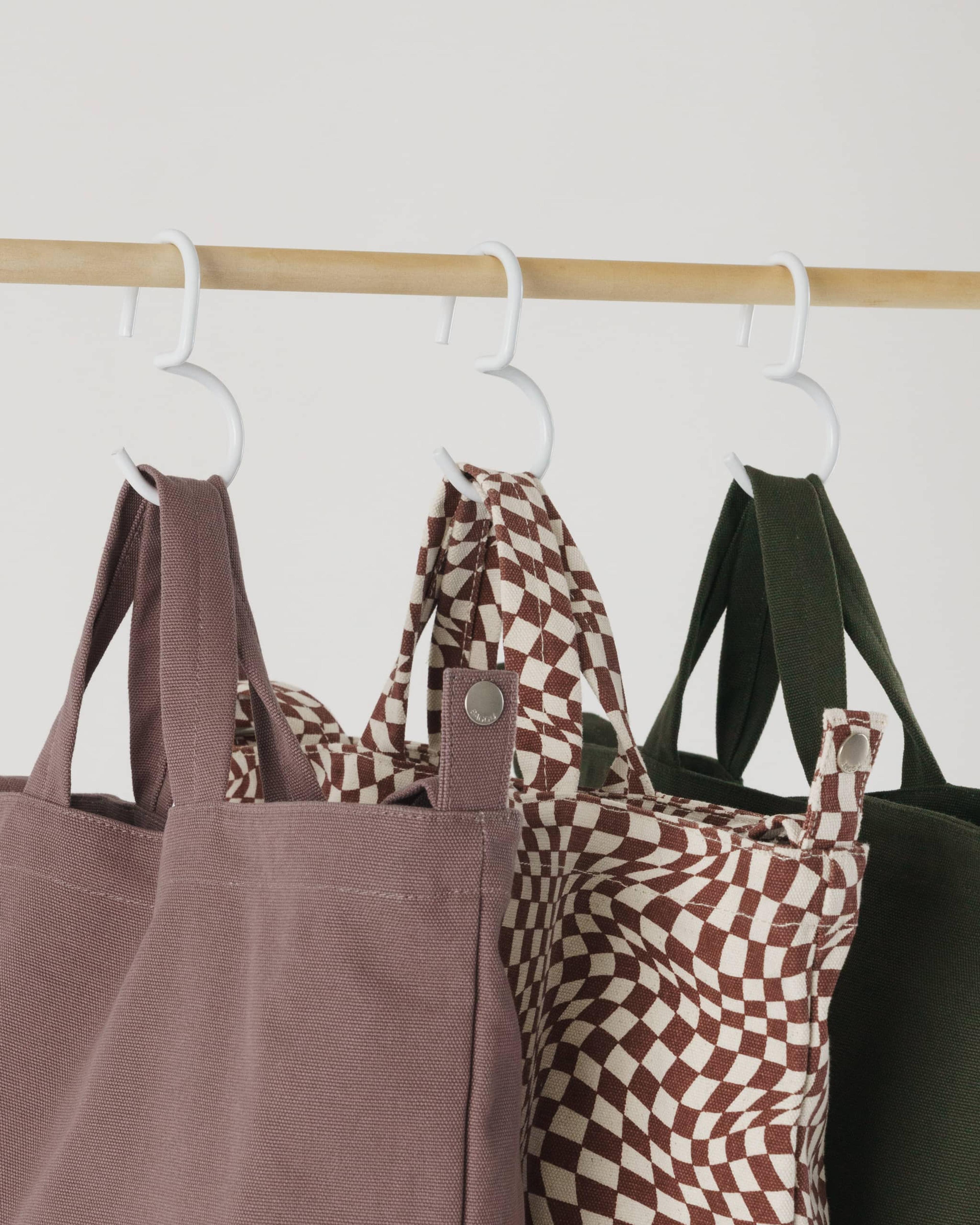 tote bags hung on hook