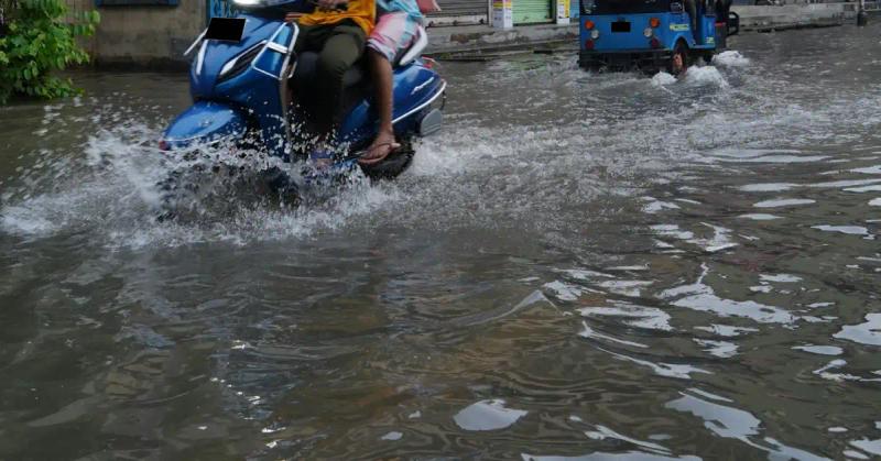Motorbike Goes Through Waterlogged Area in Bali