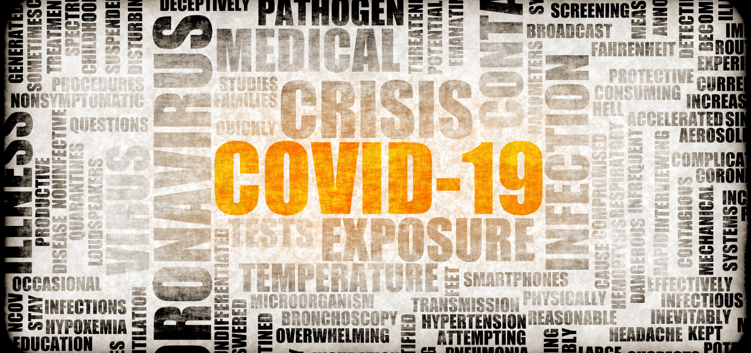 Covid 19 highlighted in newspaper cut out word cloud