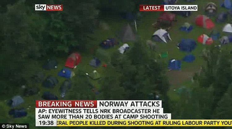  Screenshot with an overview overview of a campsite with an unknown number of tents. Text on screen: "Sky news. Latest Utoya Island. Breaking news: Norway attack. AP: Eyewitness tells NRK boradcaster he saw more than 20 bodies at camp shooting.