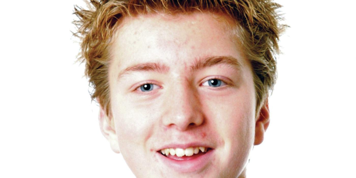 Portrait of a smiling young man with a blue hoodie sweater. 