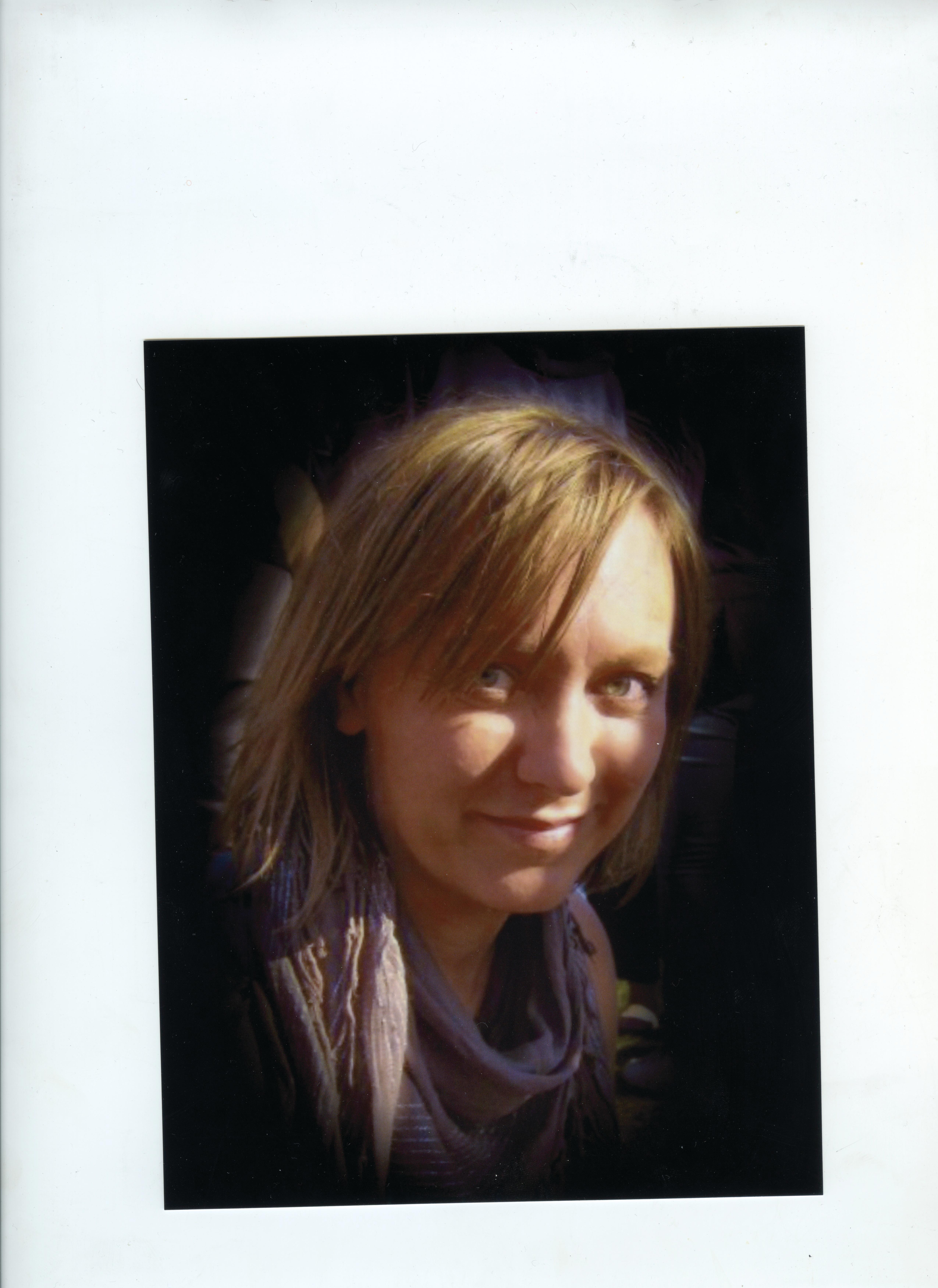 Portrait of a young person with a scarf around his neck