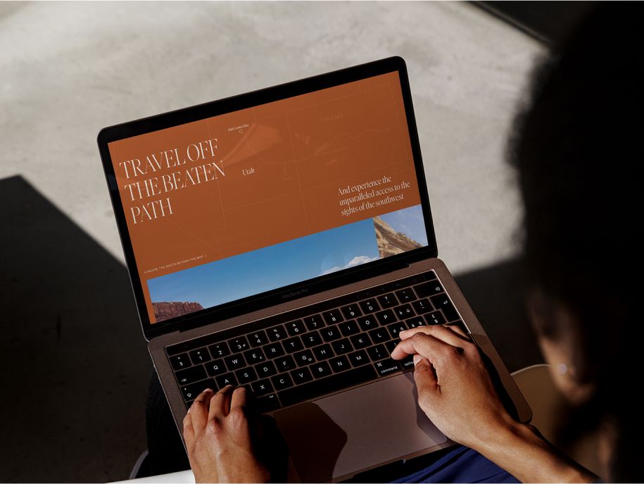 A customer browsing the Canyon Spirit website on a laptop