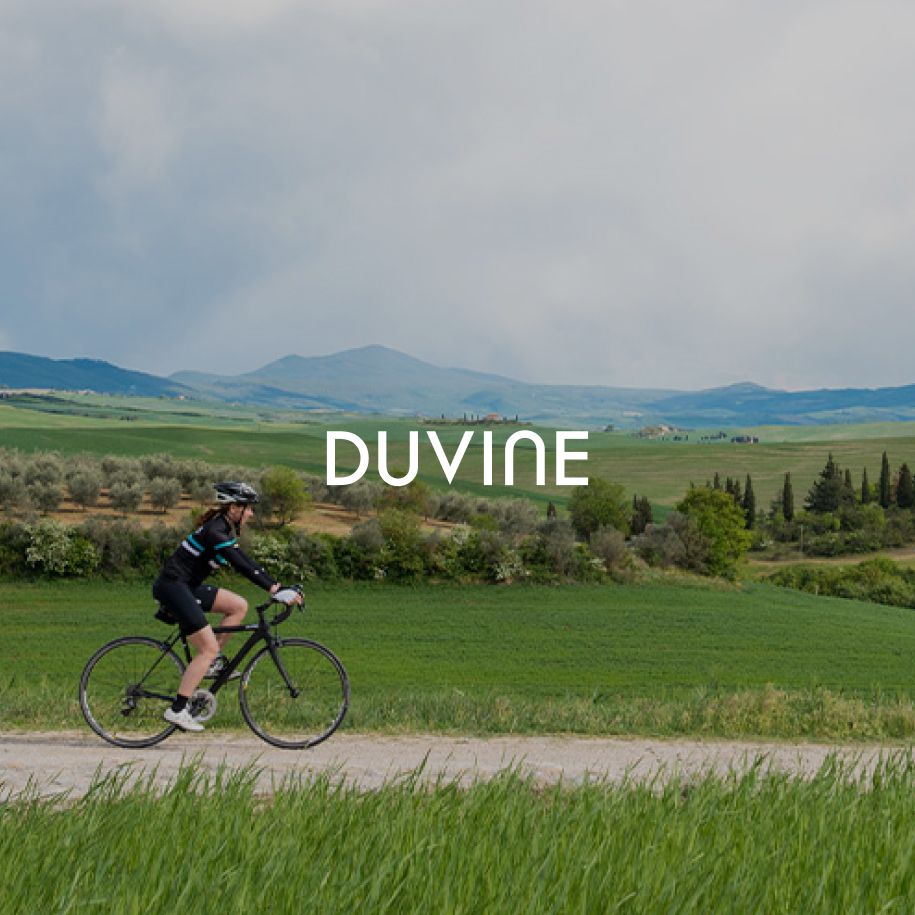 DuVine cyclist riding through a picturesque landscape