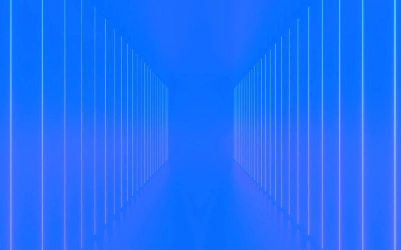 Abstract blue background with glowing vertical lines creating a perspective tunnel.