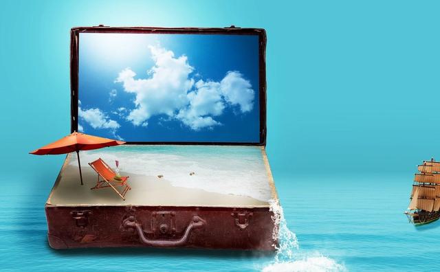 Suitcase open on beach with sky like a laptop setting
