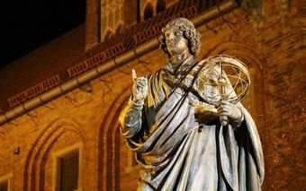 Statue of scientist holding an astrolabe