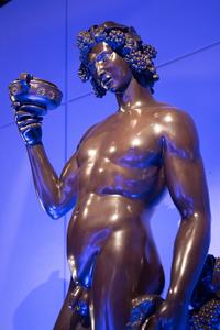 Statue of Bacchus holding grapes