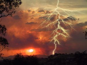 lightning hitting desert floor in sunset
