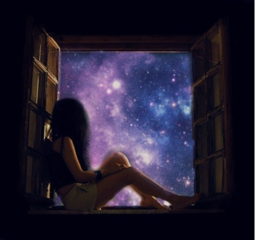 Girl in window looking out at universe at night with stars