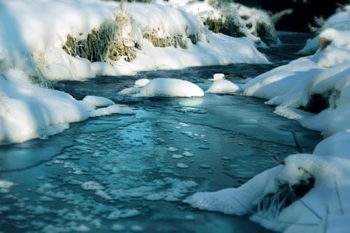 Icy stream with snow
