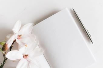 White flower and notebook