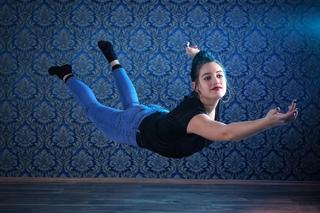 girl flying in room