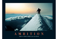 Climber on top of snowy mountain with words ambition