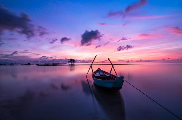 Colorful sunrise with boat