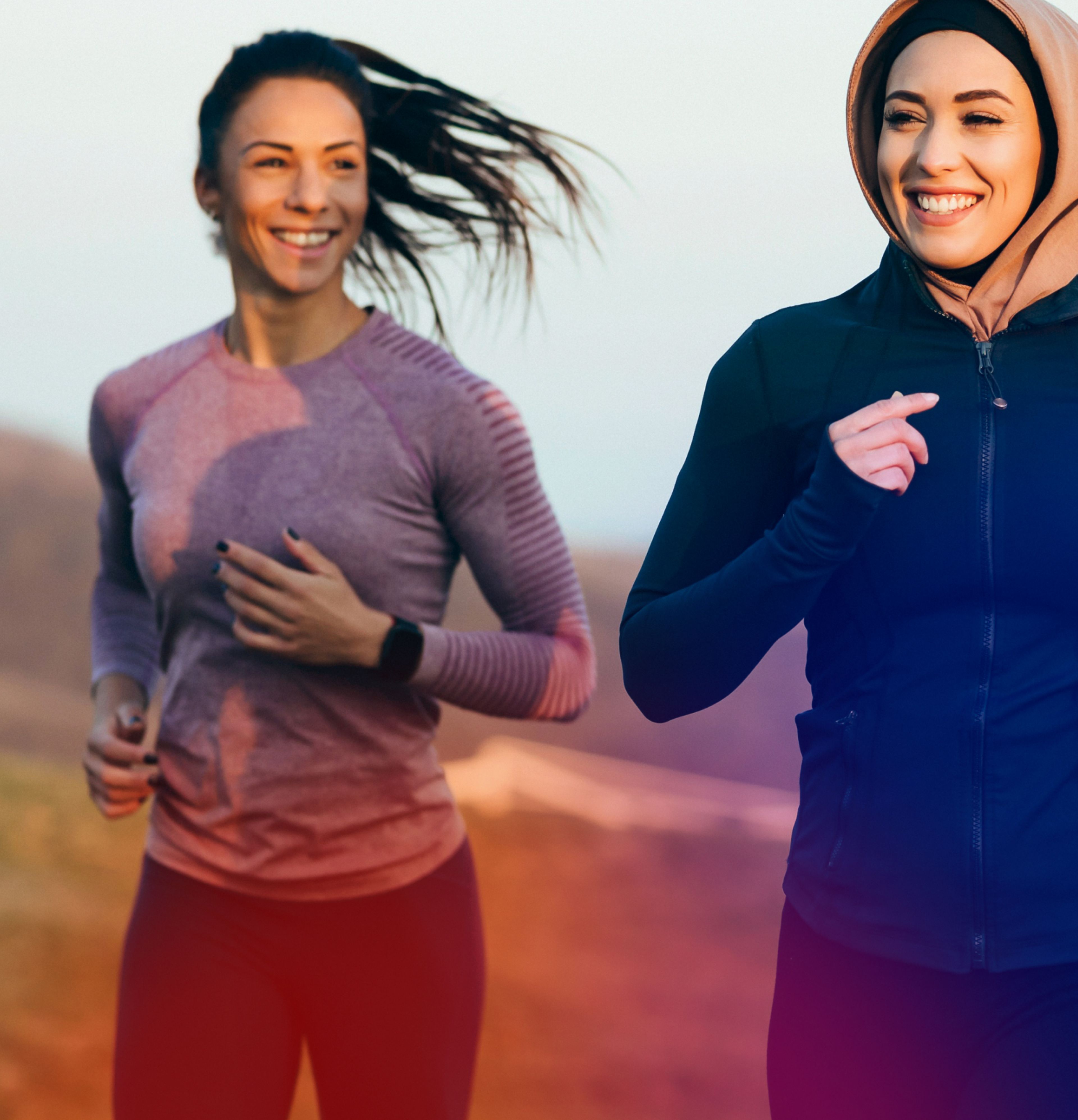 Two women running outdoors