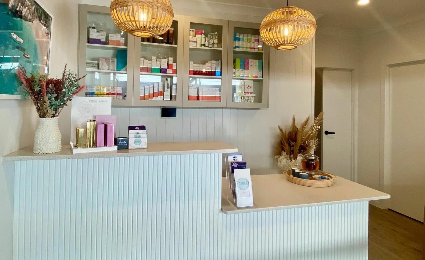 Reception desk and skincare shelves at Azure Skin and Beauty