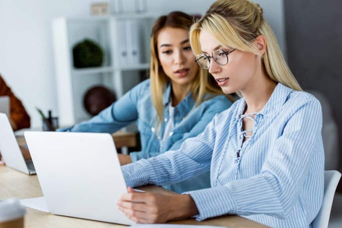 two women brainstorming digital marketing strategies for small businesses