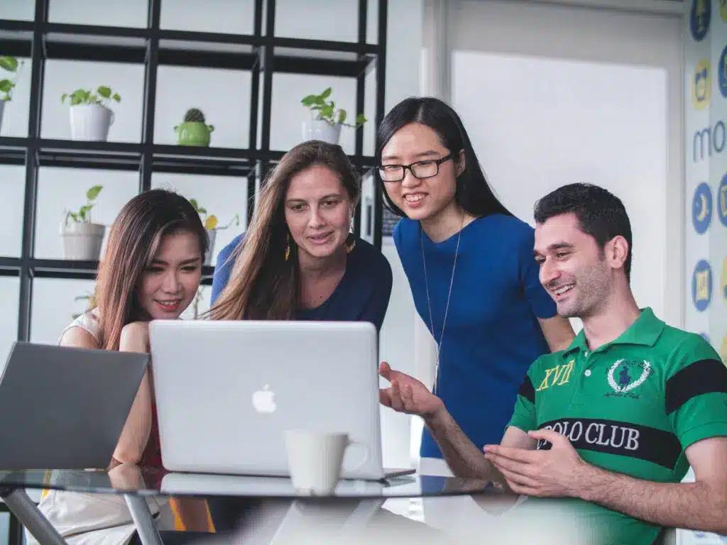 A picture of people discussing What's On Your Website About Page And How To Use It To Engage Your Audience