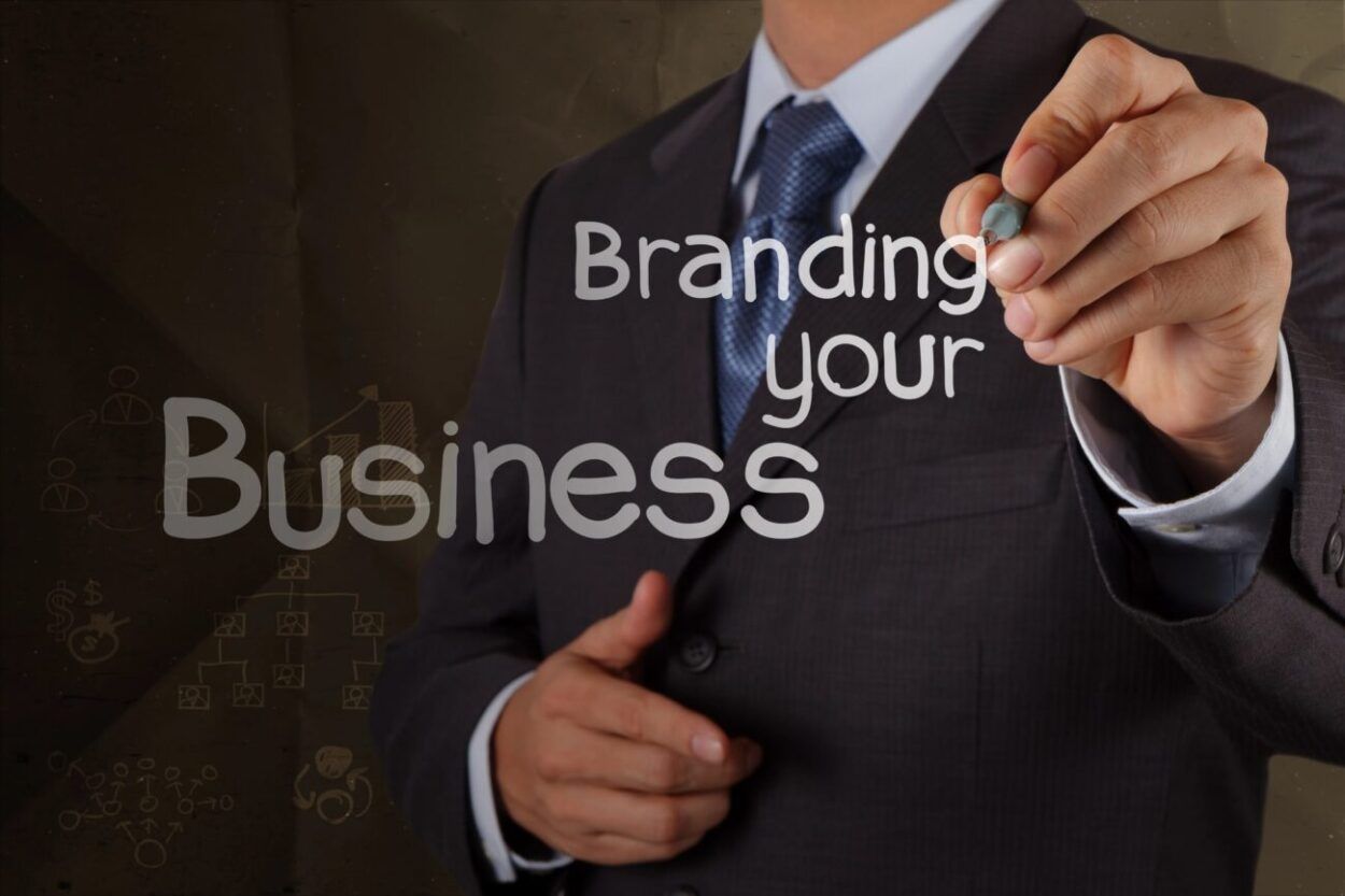 A man writing branding your business for locals.