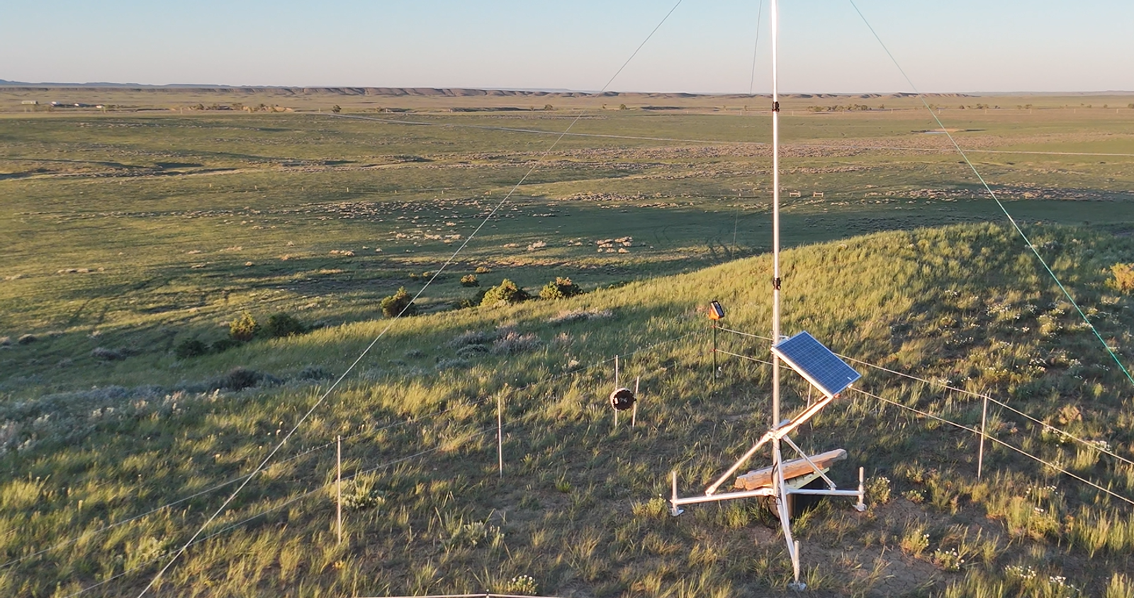 eShepherd LoRa base station and solar panel in rolling hills