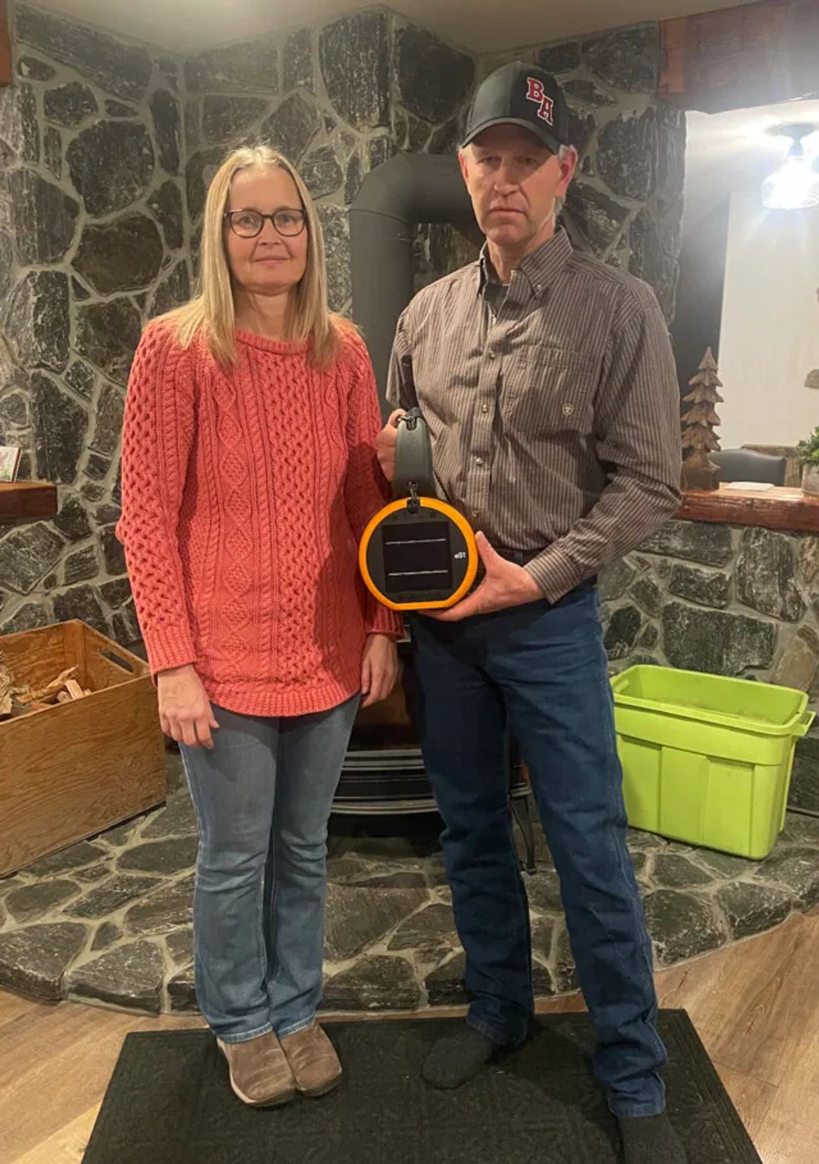 Matt Quaedvlieg and his wife at Barrington Ranch holding an eShepherd neckband