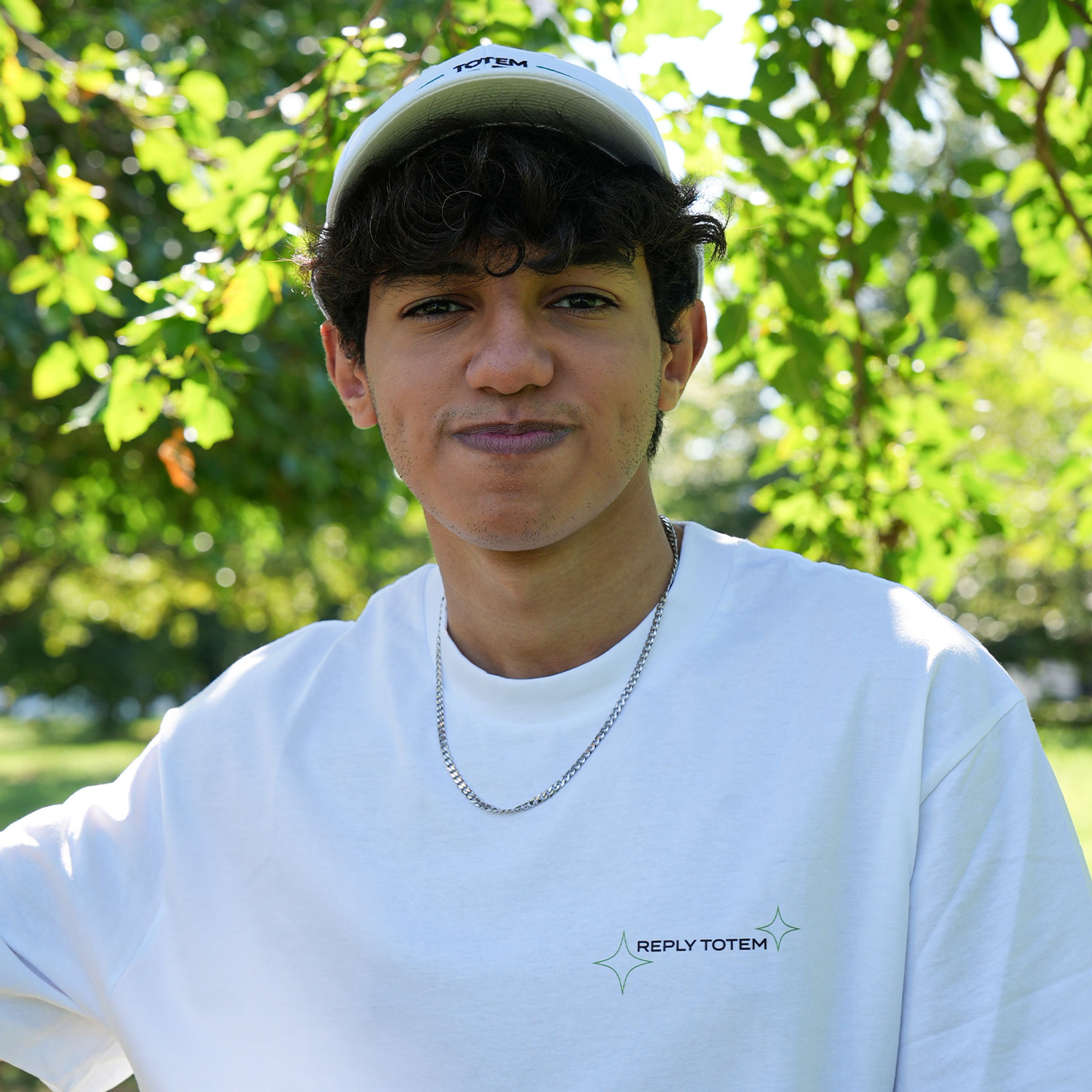 photo of Maru with the "Totem World T-Shirt" and "Totem World Hat" white edition