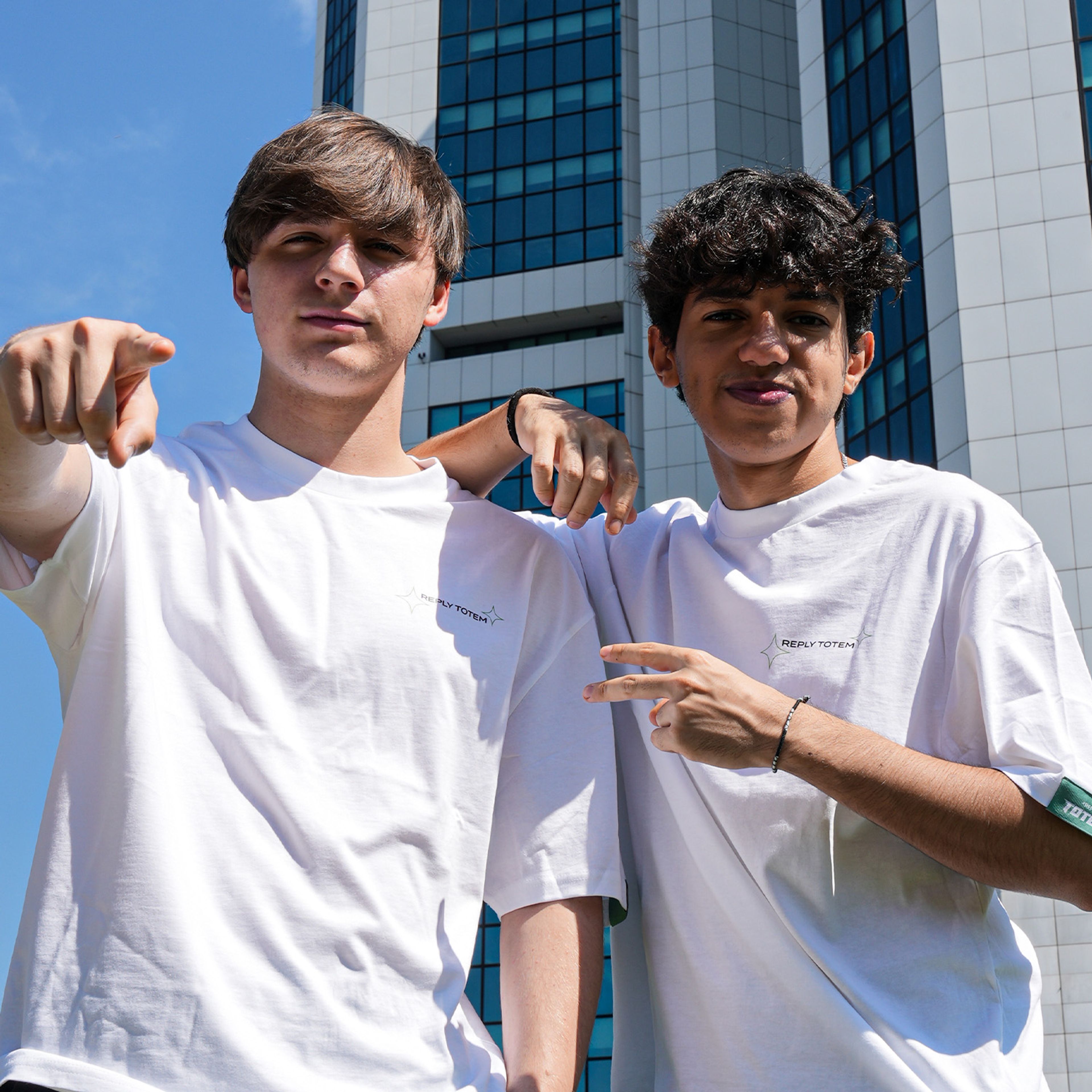 photo of maury (on the left) and maru (on the right) wearing the "Totem World T-Shirt" white edition