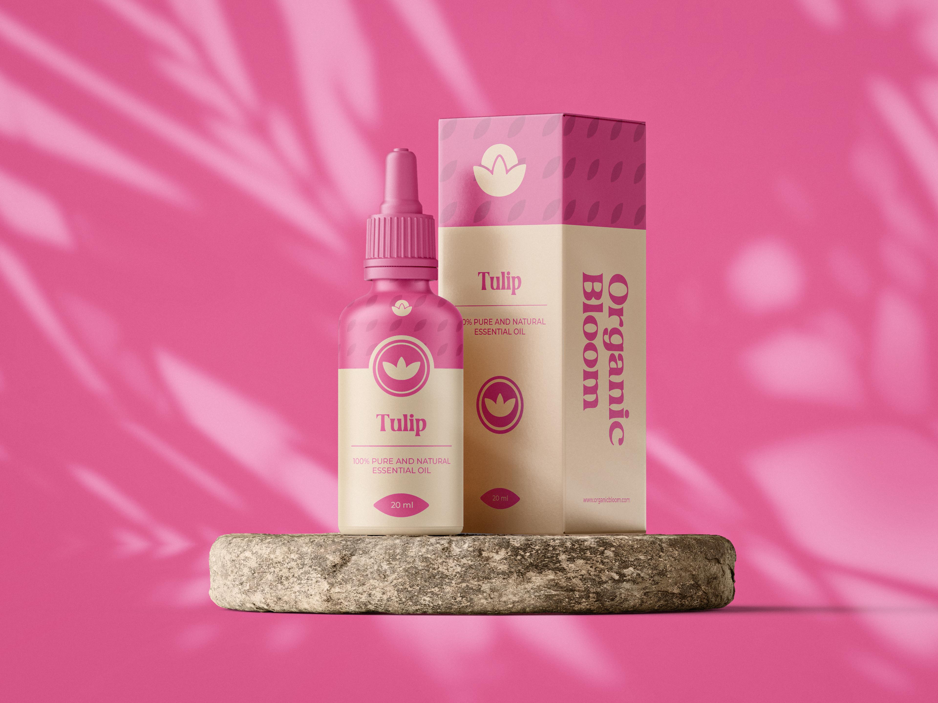 The image shows the dropper bottle and packaging for pink Organic Bloom's essential oil "Tulip"