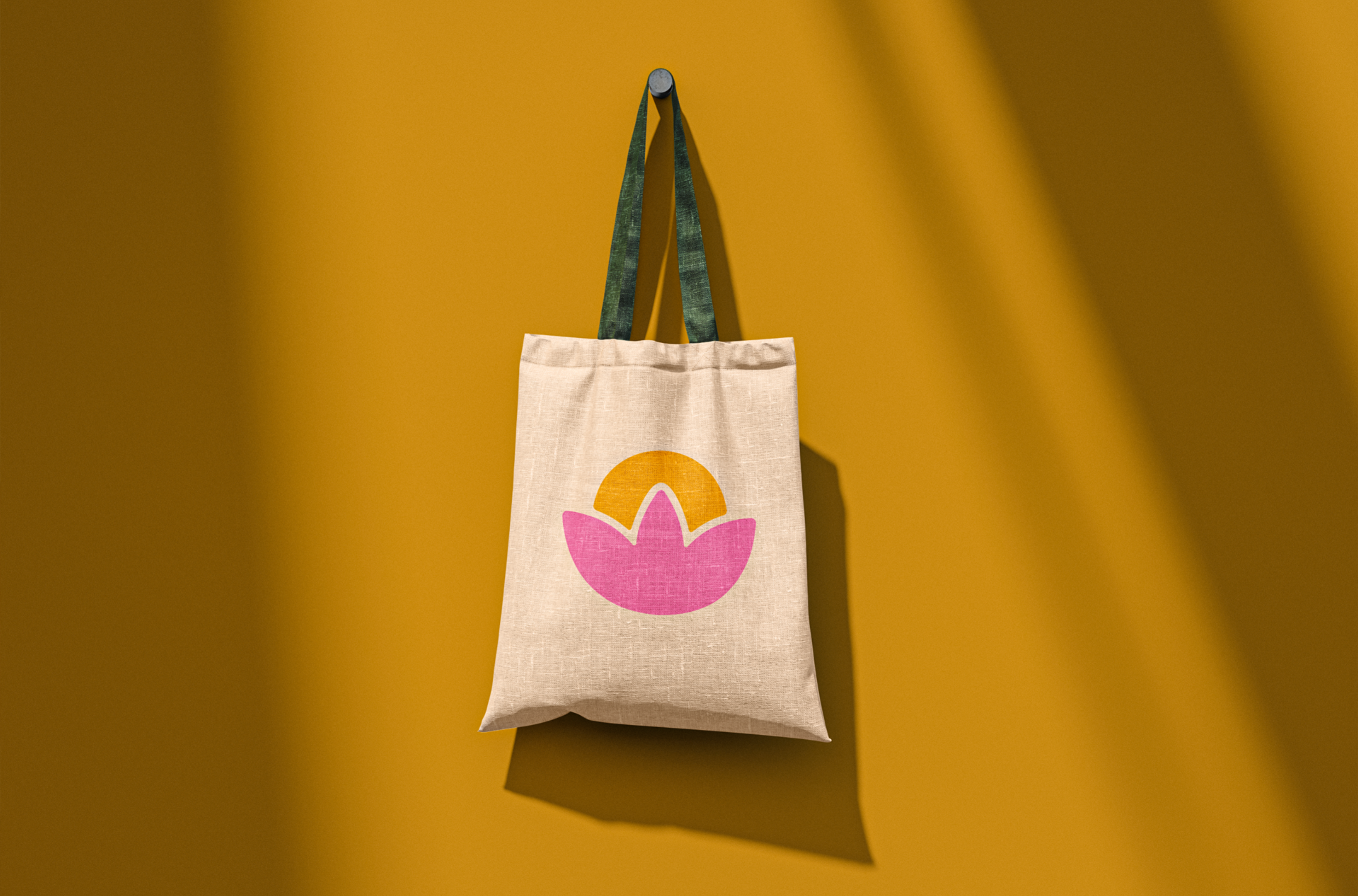 Organic Bloom tote bag hanging on a wall