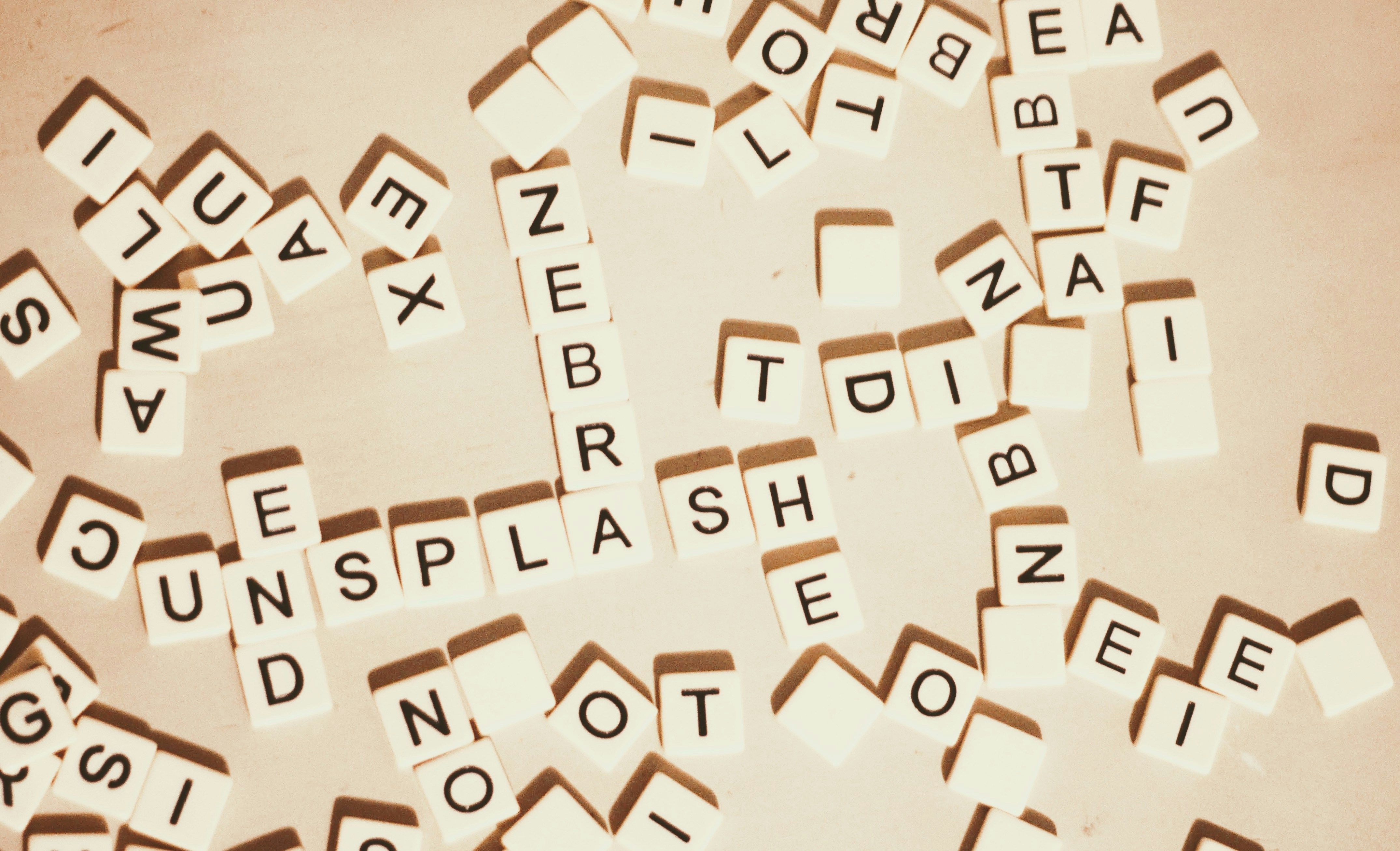Scrabble dice word game - Strands vs Wordle