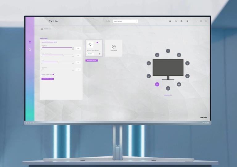 Philips Evnia gaming monitor displaying the Ambiglow settings interface, with customizable lighting controls and a screen layout preview, against a modern blue-lit background.