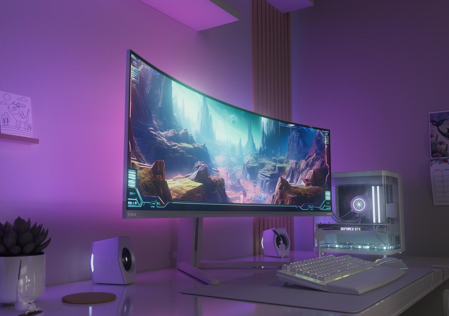 Modern gaming setup featuring a curved ultrawide Philips Evnia monitor displaying a fantasy game landscape, with white speakers, RGB-lit keyboard, and gaming PC, illuminated by purple ambient lighting.