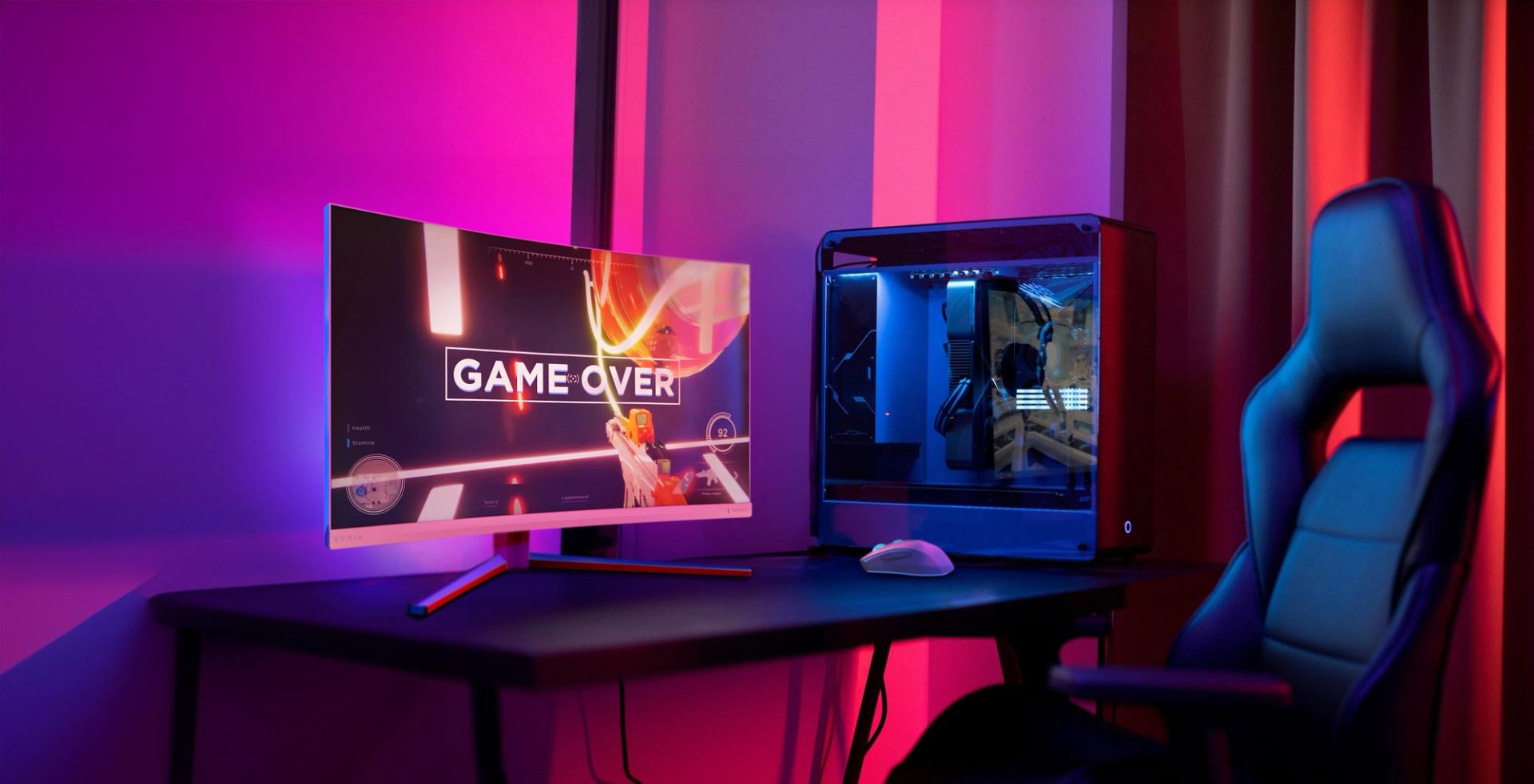 a man on the Philips Evnia gaming monitor set up with headset