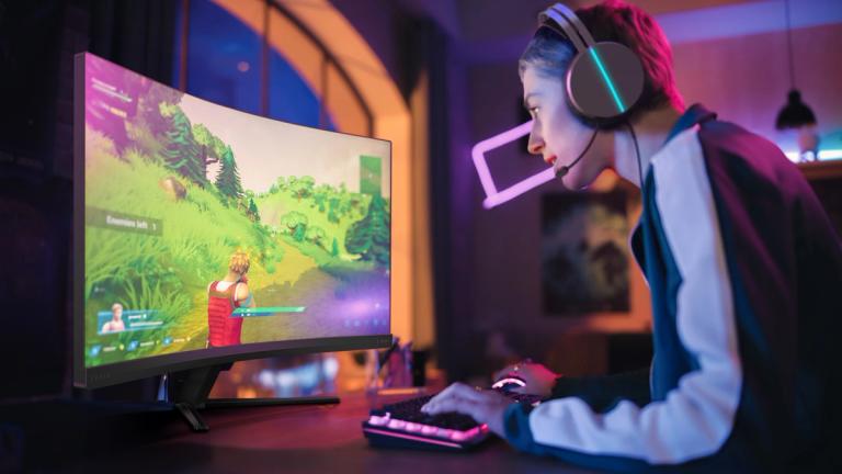 a man plays a game with Philips Evnia monitor