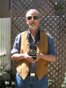 Pete Eckert holding a camera