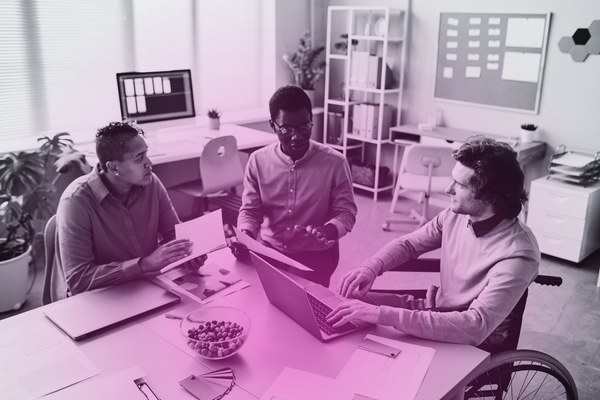 three people working at a table