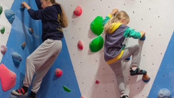 Two children climbing at a RockeeZ session