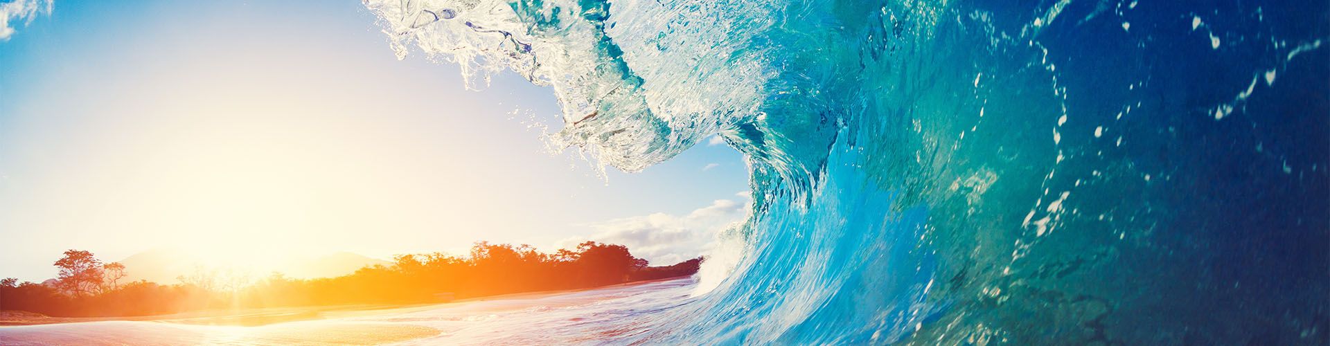 Ocean wave at sunset