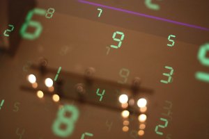 A dark background with green digital numbers 