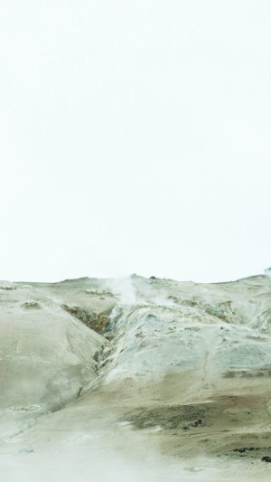 Green-tinted sand dune.