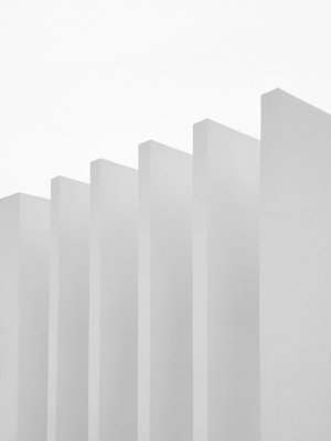 Six grey rectangular pillars spaced evenly against a white background.