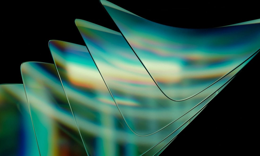 A series of translucent green squares stacked  against a black background.