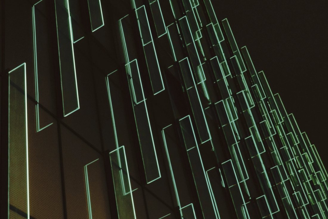 Translucent green layers on a black background.
