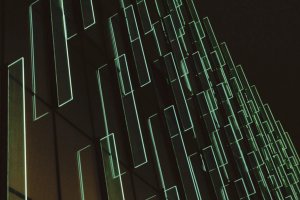 Translucent green layers on a black background.